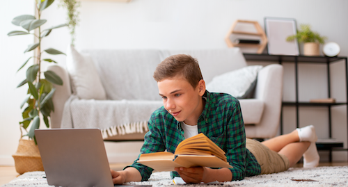 middle school student studying on computer